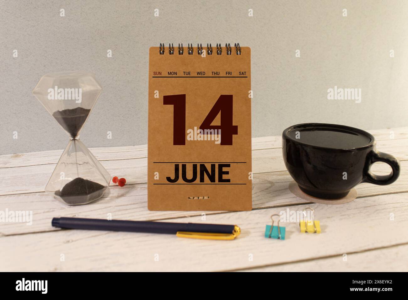 June 14, date on the calendar. International Webloggers Day. Handmade wood cube with date month and day. planning for the day. artistic coloring. sele Stock Photo