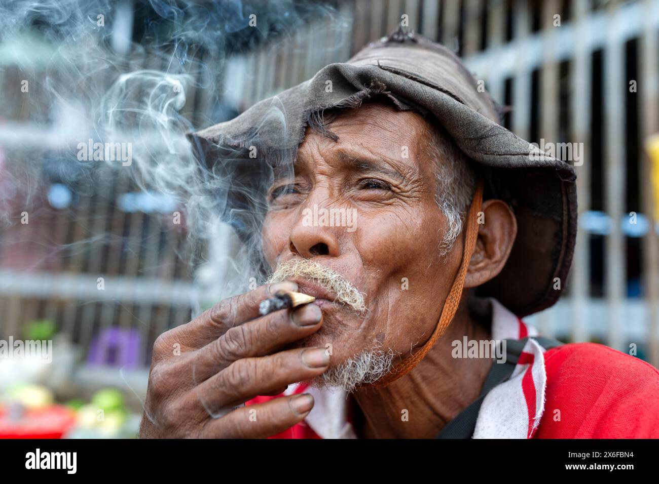 Smoker at Mercado Taibesi, Dili, Timor-Leste Stock Photo