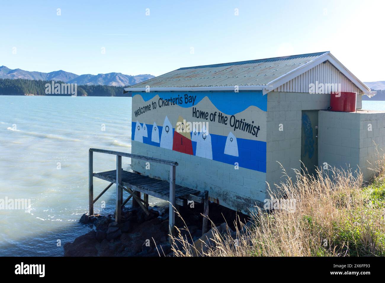 Welcome mural on side of boat shed, Marine Drive, Charteris Bay, Lyttelton Harbour, Banks Peninsula, Canterbury, New Zealand Stock Photo