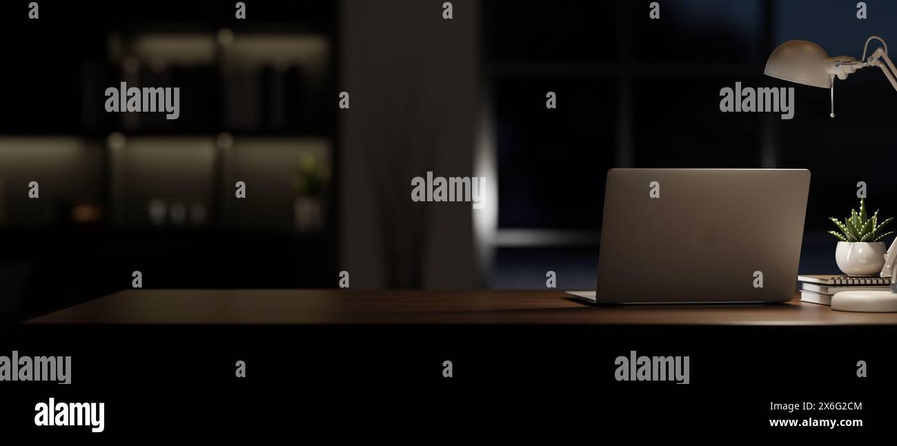 A back view image of a laptop computer on a table in a modern dark room ...