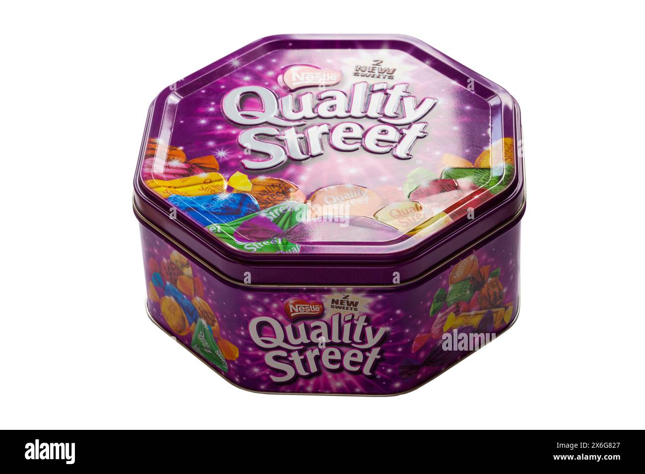 Tin of Nestle Quality Street chocolates sweets metal tin isolated on white background Stock Photo