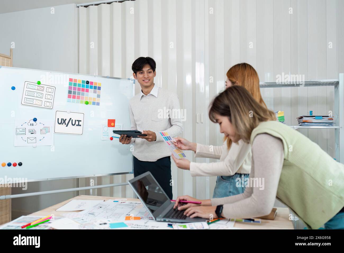team of UI UX web designer are working together to develop mobile ...