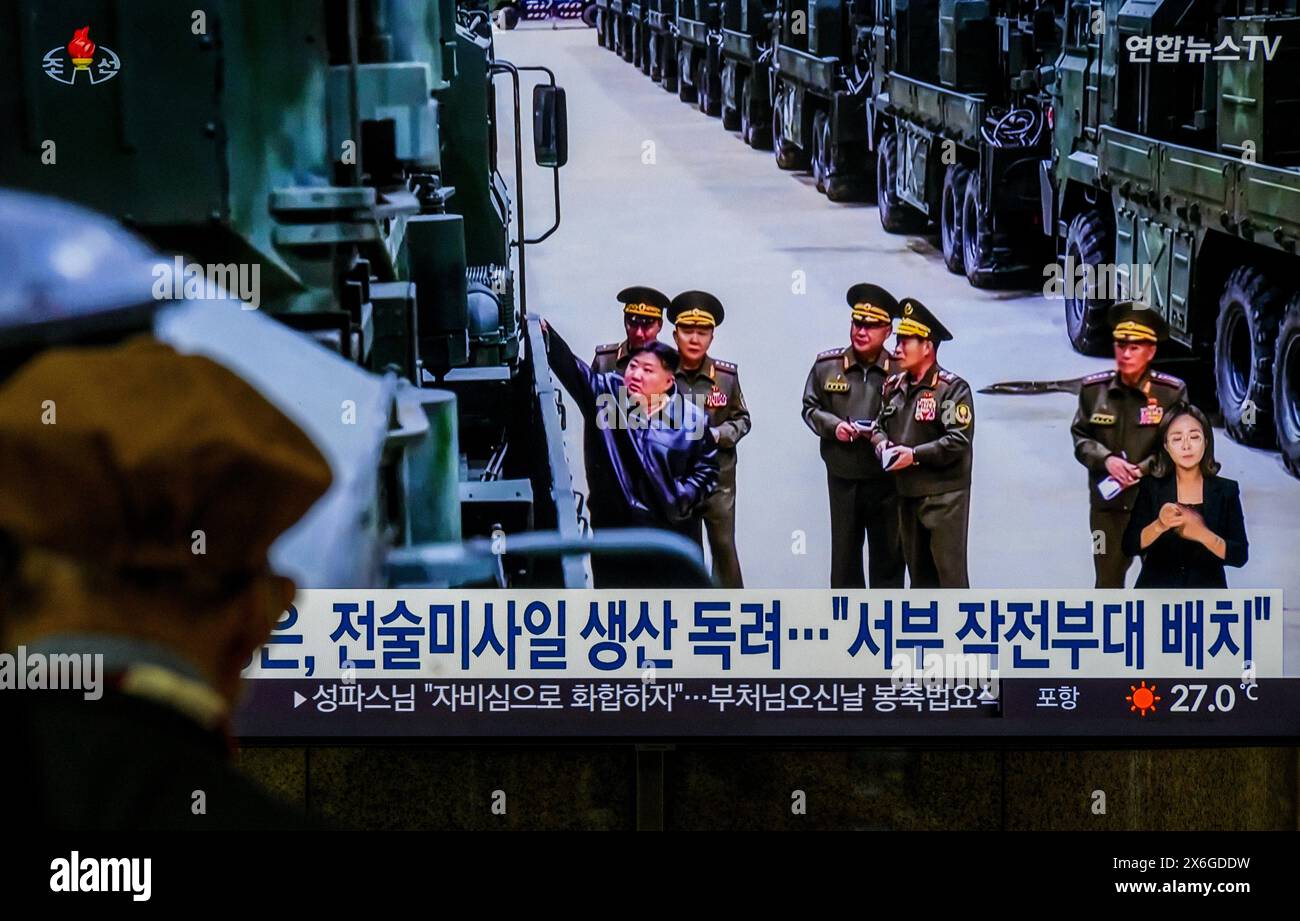 A 24-hour Yonhapnews TV broadcast at Yongsan Railway Station in Seoul shows North Korean leader Kim Jong inspecting a new tactical missile weapons system, to be newly equipped by the combined missile units of the Korean People's Army, at an undisclosed site. North Korean leader Kim Jong-un has inspected a new tactical missile weapons system and called for an 'epochal change' in war preparations by attaining arms production plans, state media said on May 15.North Korean leader Kim Jong-un oversaw the 'tactical missile weapons system to be newly equipped by the combined missile units of the Kore Stock Photo