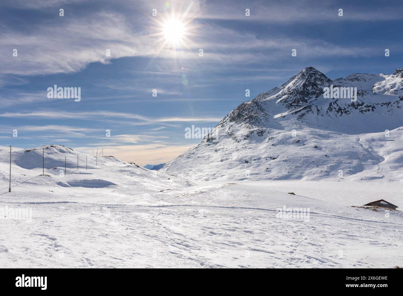Spectacular landscape of the Bernina Pass in Switzerland on a winter day with lots of sunshine. All the mountains are covered with a lot of snow. Nobo Stock Photo