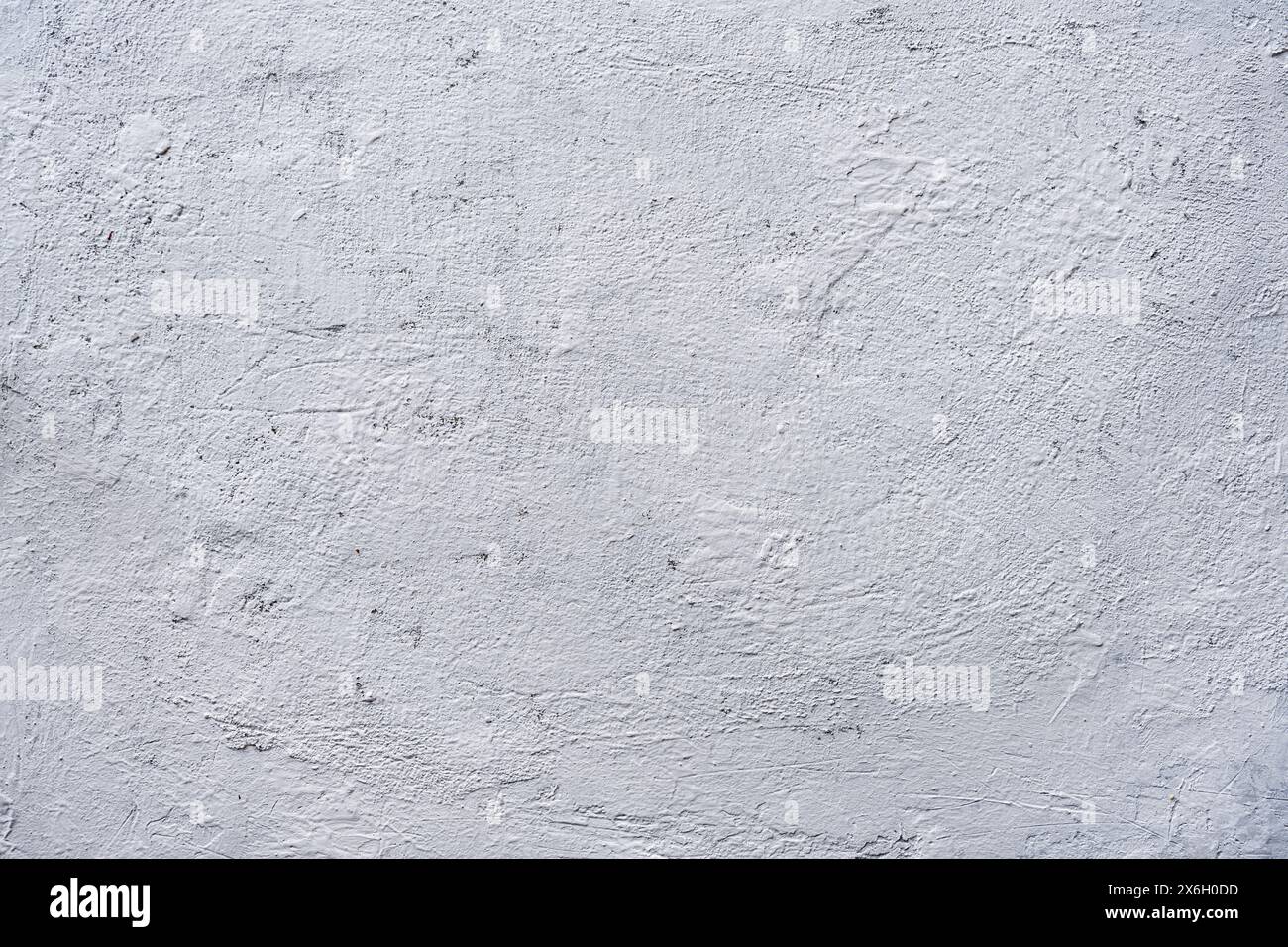 White or gray rough grainy concrete wall texture background. Stock Photo