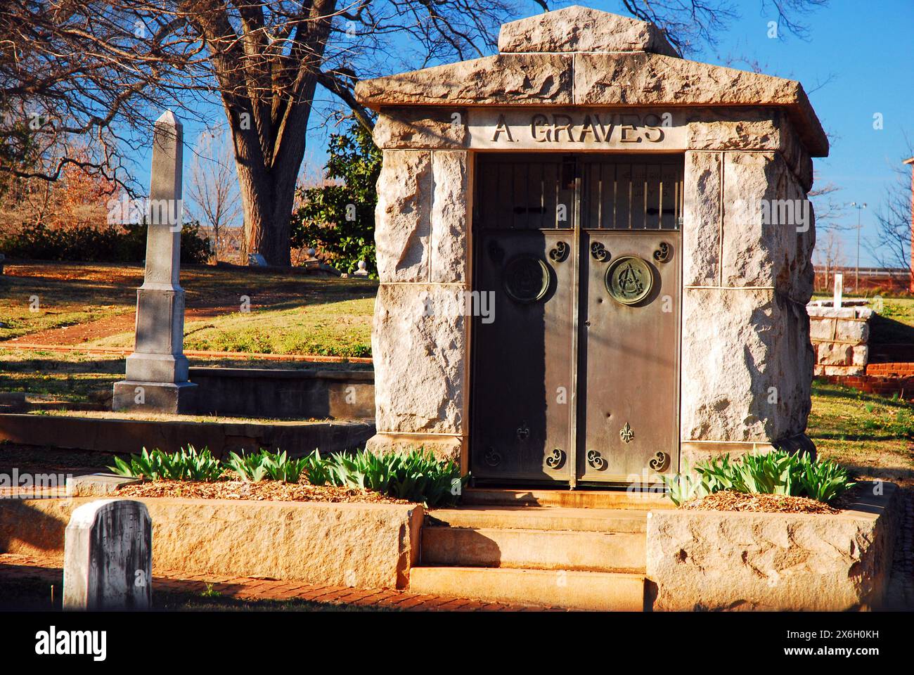 A  large stone mausoleum stands in the historic Oakwood Cemetery in Atlanta Stock Photo