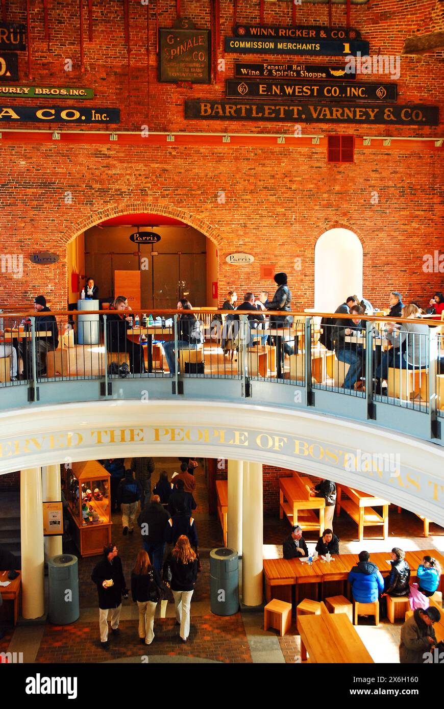 A two storied food court In Boston's Quincy Market offers visitors a place to relax and eat from the location's many vendors Stock Photo