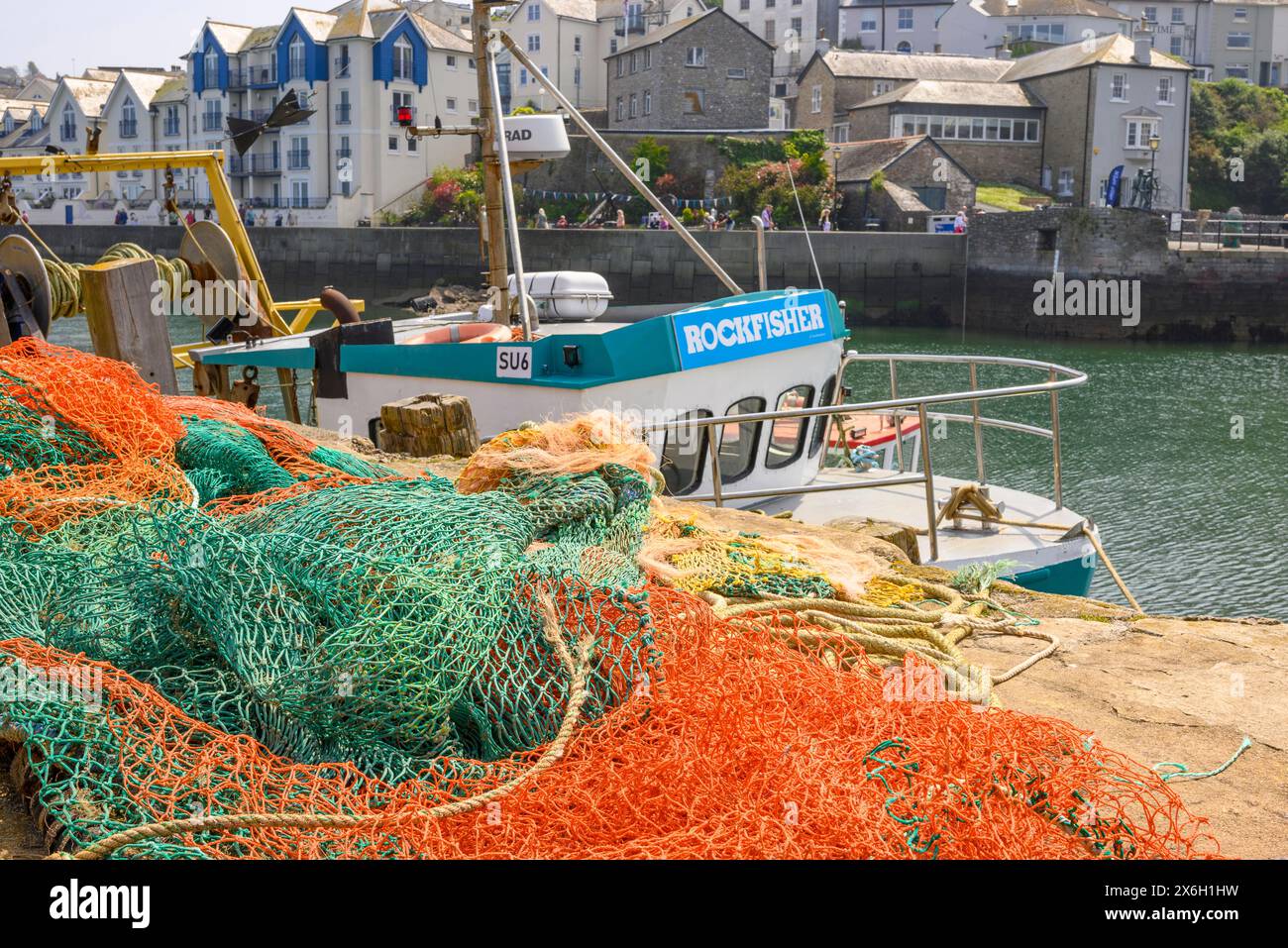 Fishing nets and fishing boat in the harbour, Brixham, Devon, England ...