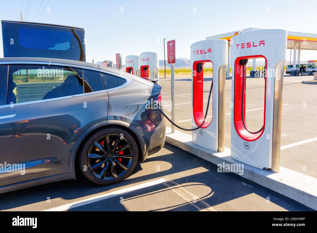 White Hills, Arizona - April 14, 2024: Charging Tesla Electric at a Supercharger Station Stock Photo