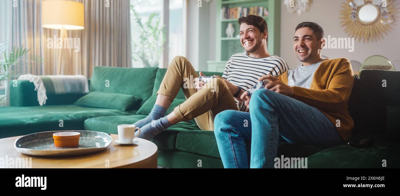 Handsome gay men playing console hi-res stock photography and images - Alamy