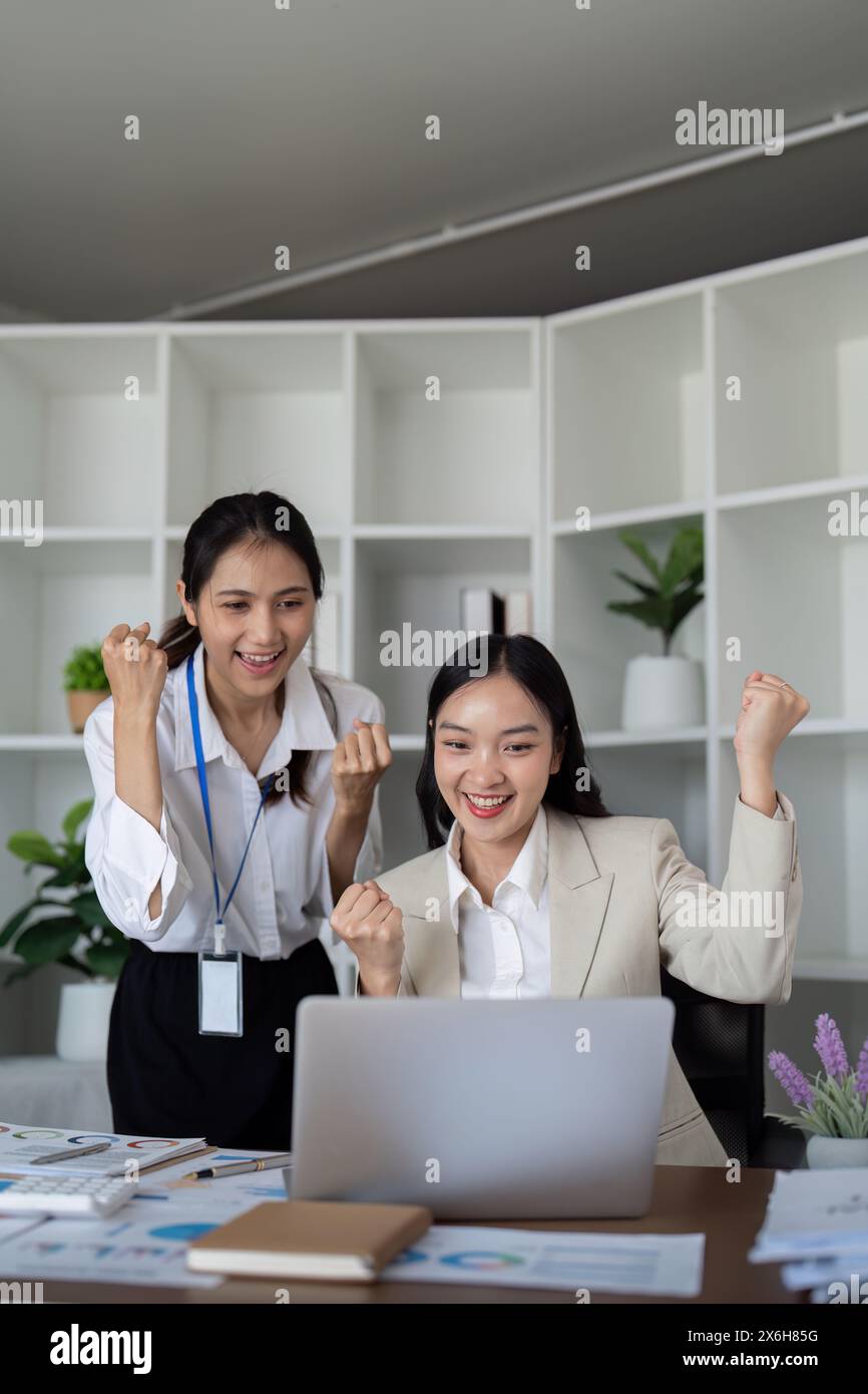 Professional businesswomen celebrating project success hi-res stock ...