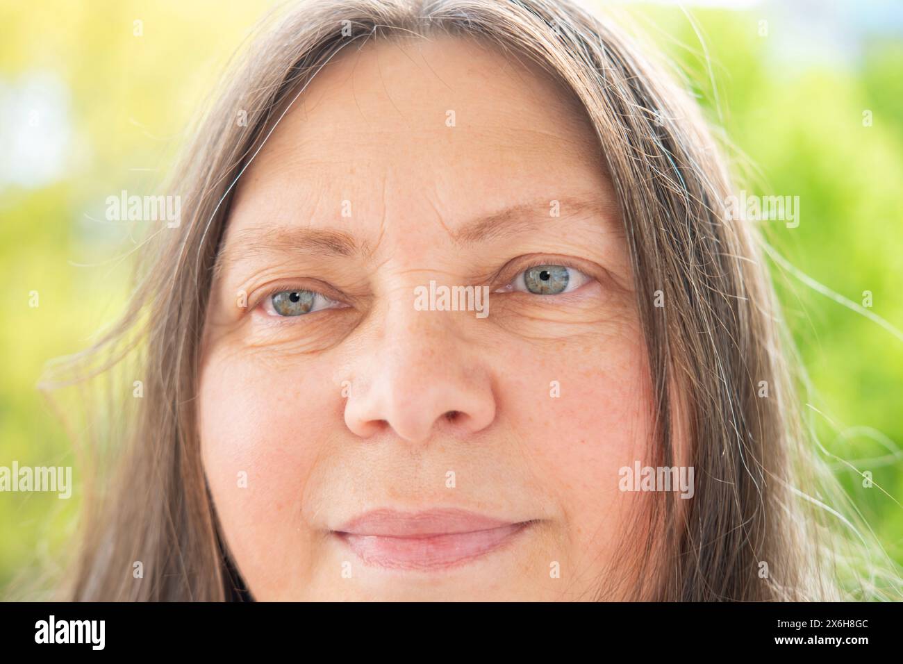 Caucasian positive 50-year-old attractive woman looking at camera ...