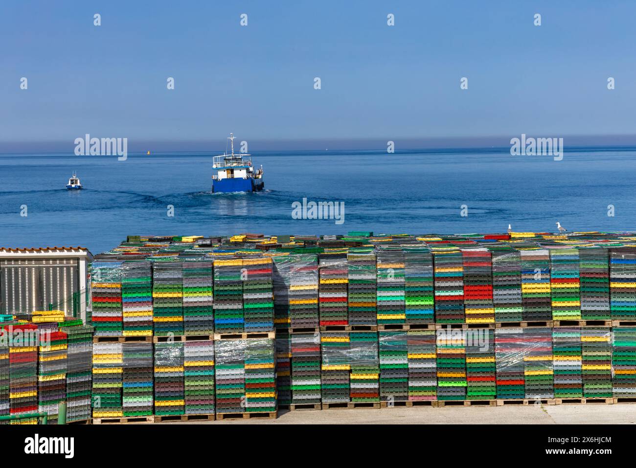 Colorful seafood crates in Croatia, ship for transporting fish and ...