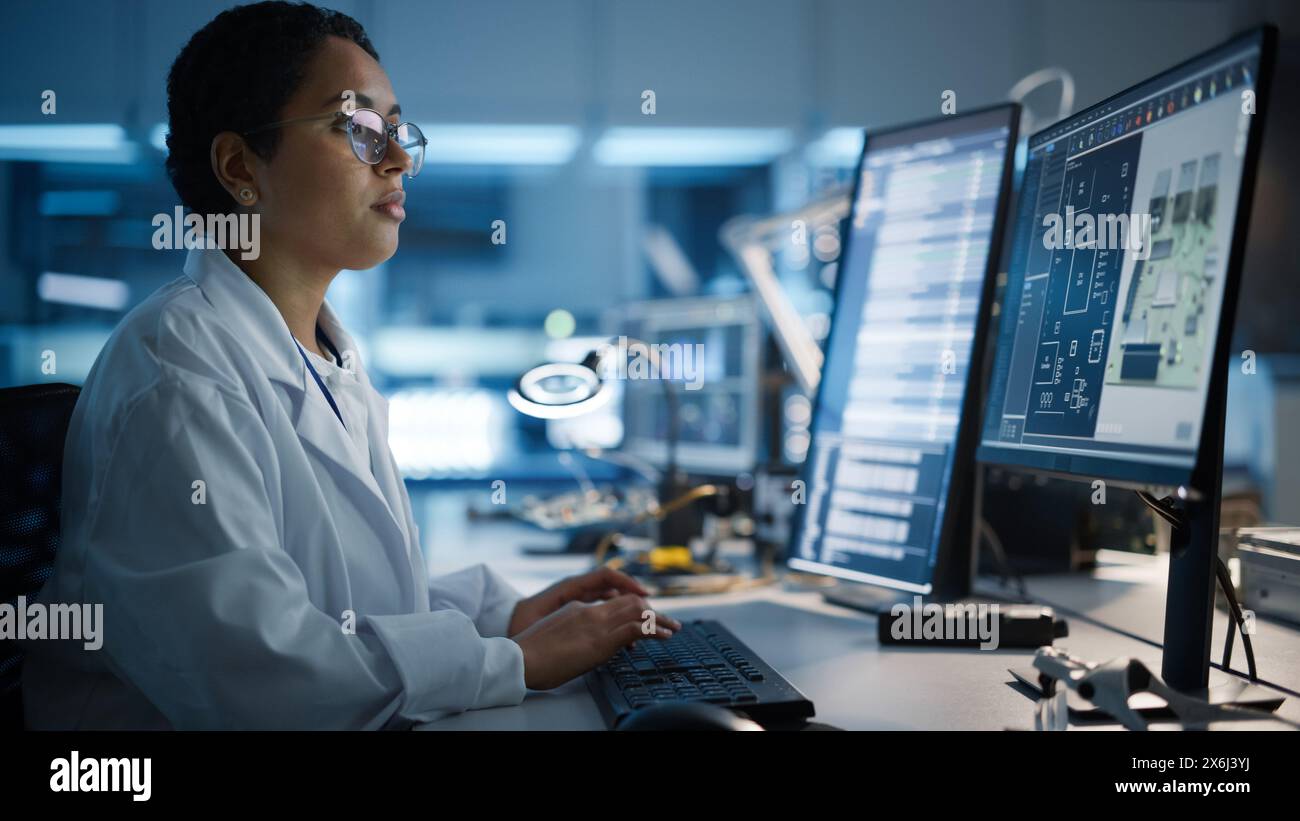 Modern Electronics Development Facility: Female Engineer Works on ...