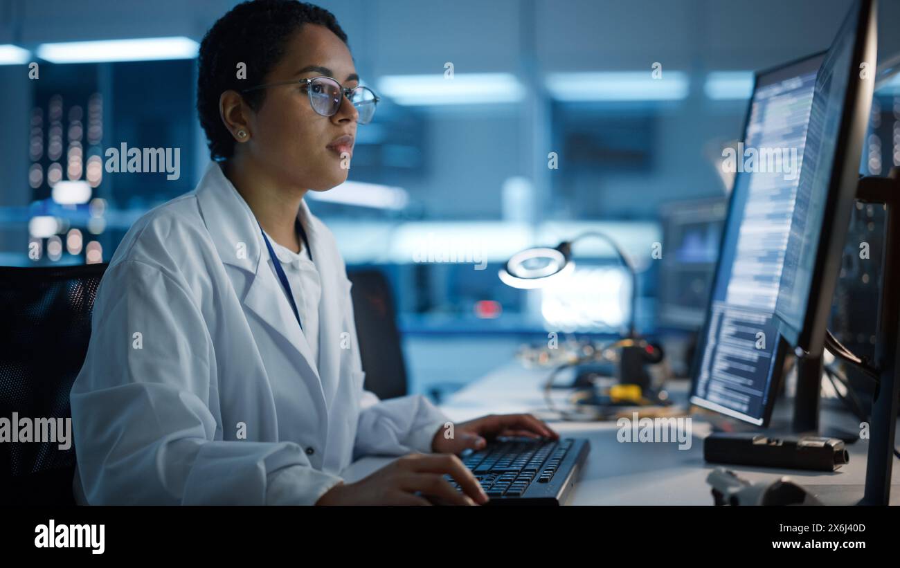 Modern Electronics Development Facility: Female Engineer Works on ...