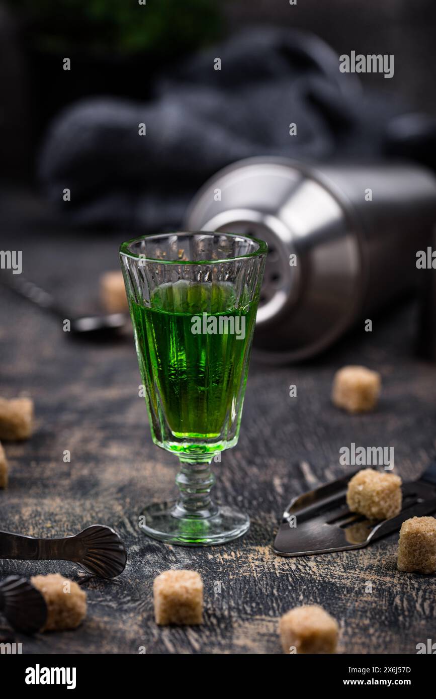 Glass of absinthe with cane sugar Stock Photo - Alamy