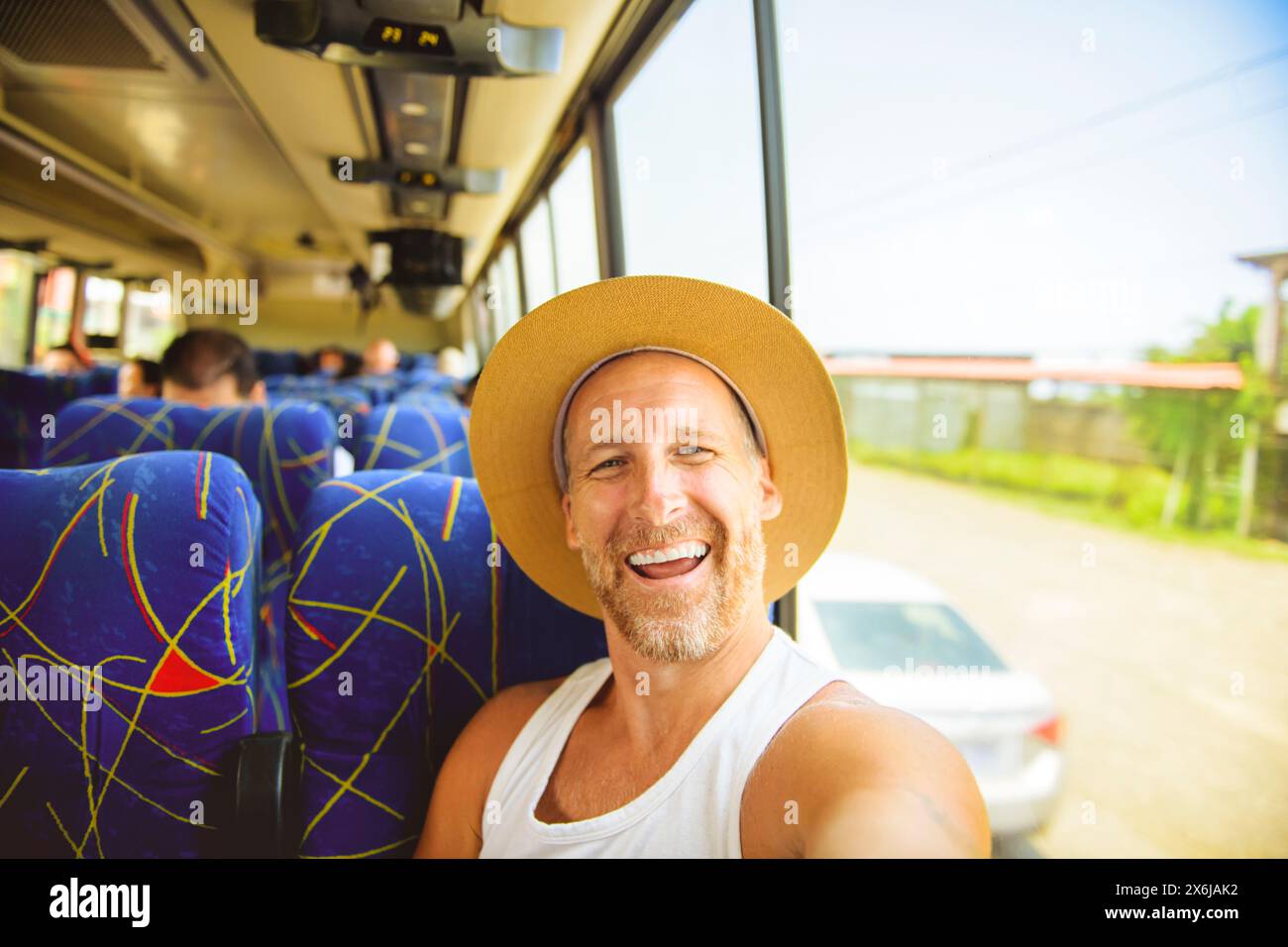 Great man riding in a traveler bus in costa Rica Stock Photo - Alamy