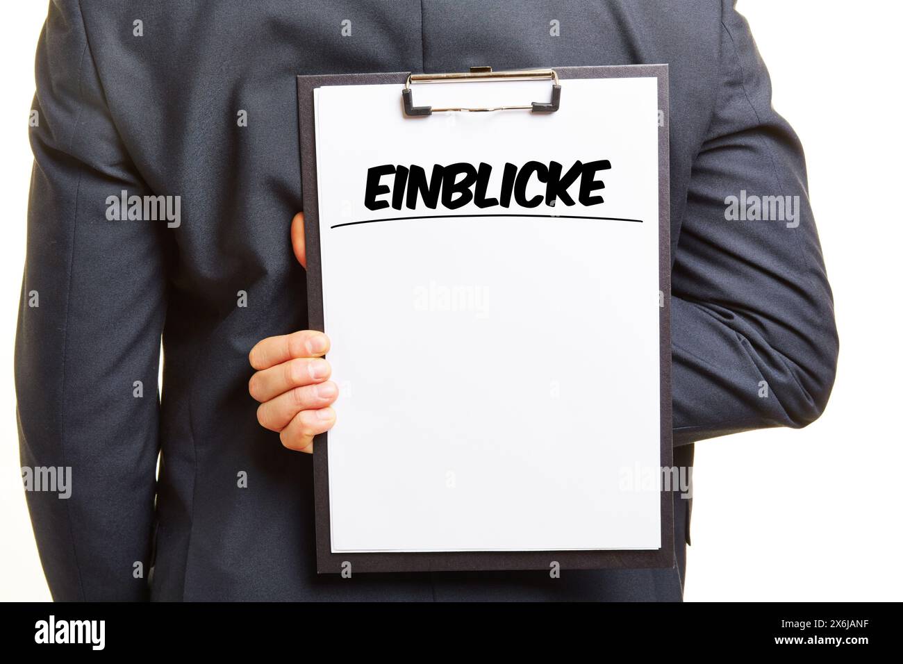 Businessman holding clipboard with headline Einblicke (German for: insights) and text space Stock Photo
