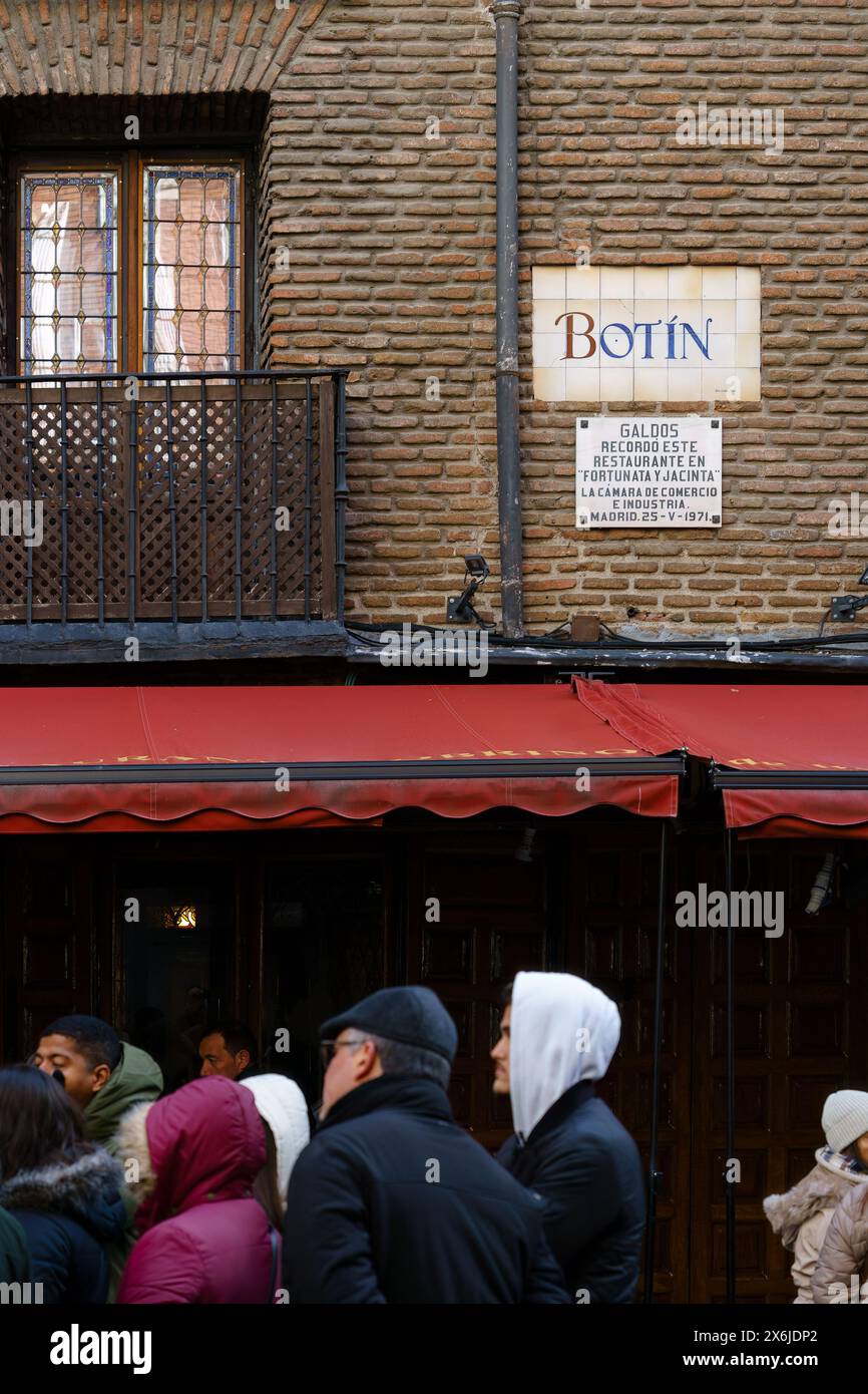 Madrid, Spain. February 11, 2024 - Group of People Standing Outside Restaurant Botin Stock Photo