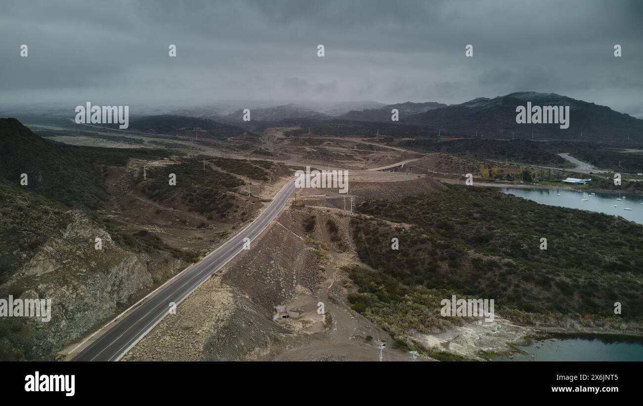 Road across the snowy Andes mountains in Mendoza, Argentina. Aerial view, high angle. Stock Photo