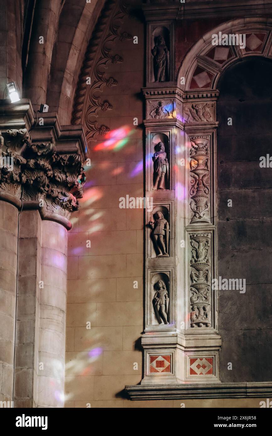 Color reflections from stained glass windows on the walls in the ...