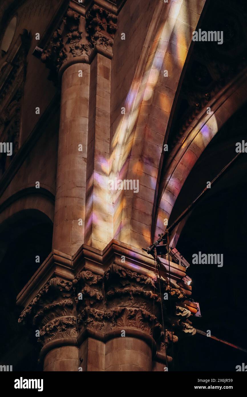 Color reflections from stained glass windows on the walls in the ...