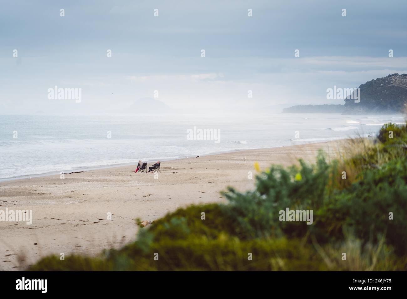 Man watching woman on beach hi-res stock photography and images - Alamy