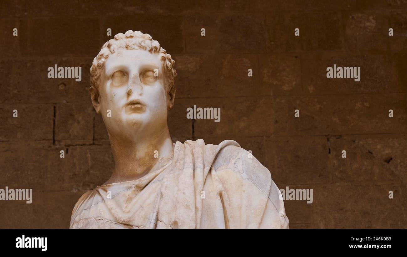Closeup of an ancient marble statue with curly hair, 2nd century BC