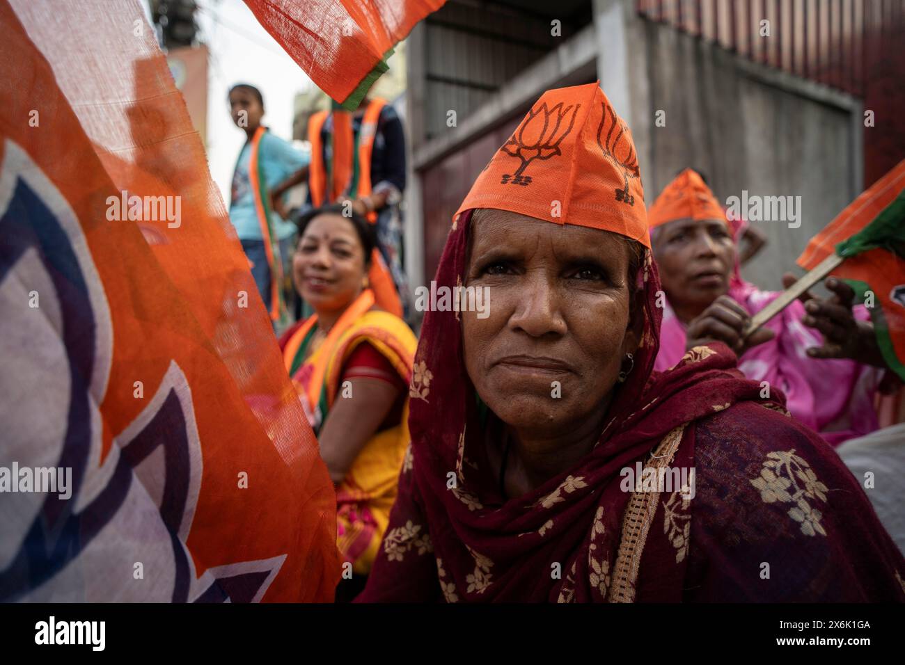 Bharatiya Janata Party (BJP) supporters arrives to to see a roadshow of Union Home minister Amit Shah, ahead of third phase of General Elections, in Stock Photo