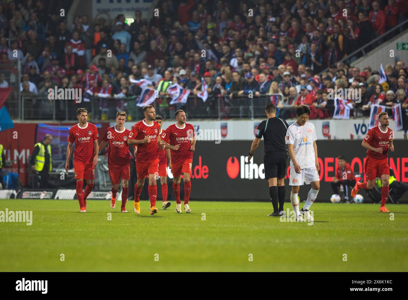 Football match, the players of 1. FC Heidenheim visibly relieved after the just scored 1:1 and at the same time final score in the match against 1. Stock Photo
