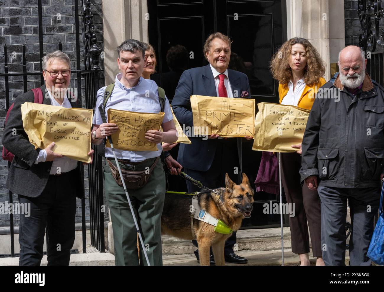 London, UK. 15th May, 2024. The National Federation of the Blind UK present petitions to 10 Downing Street on the dangers of floating bus stops for sight impared users; they were accompaned by Finn, the guide dog. Credit: Ian Davidson/Alamy Live News Stock Photo