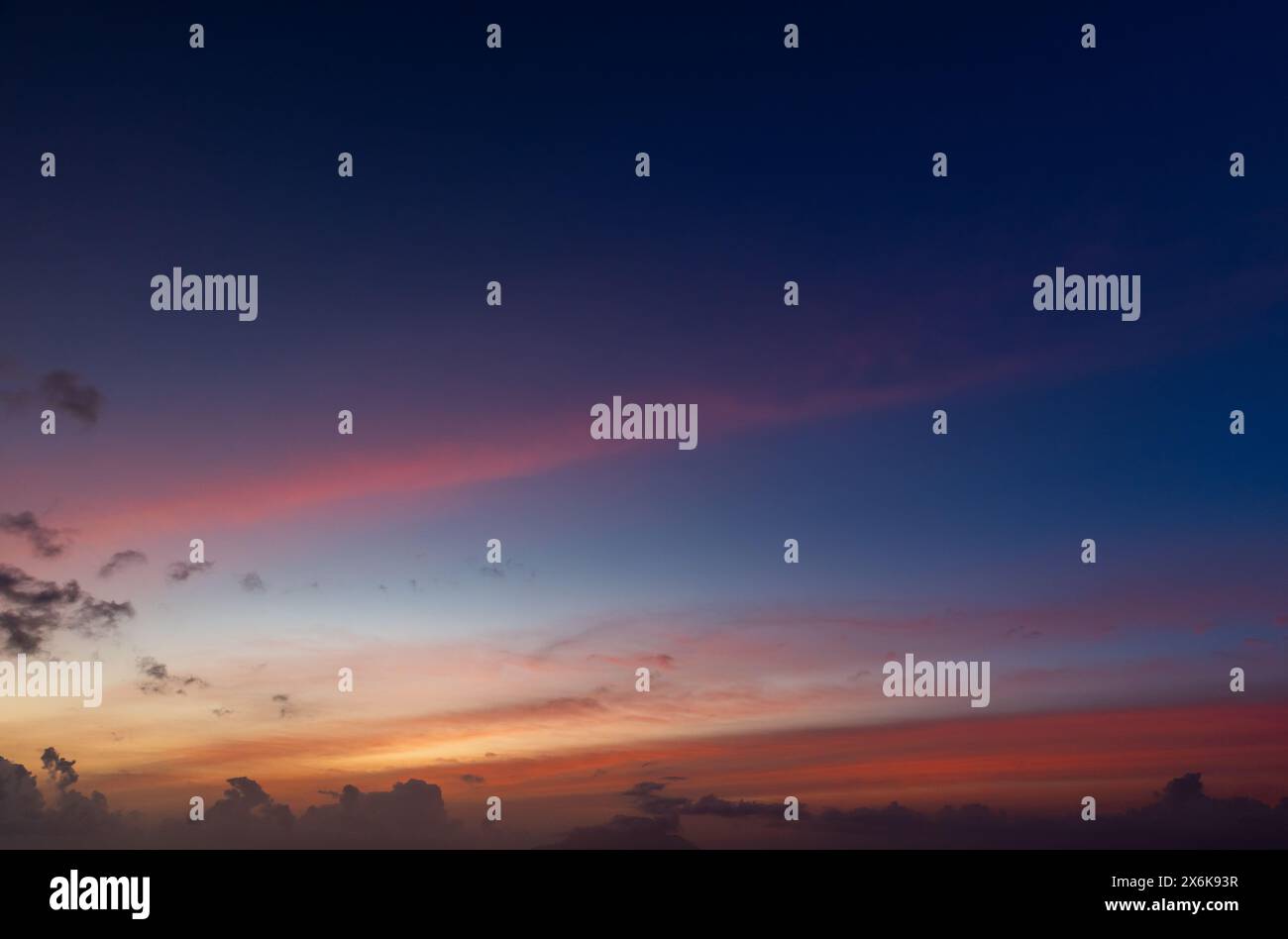 Colorful clouds are under deep blue sky on a sunset, background photo Stock Photo
