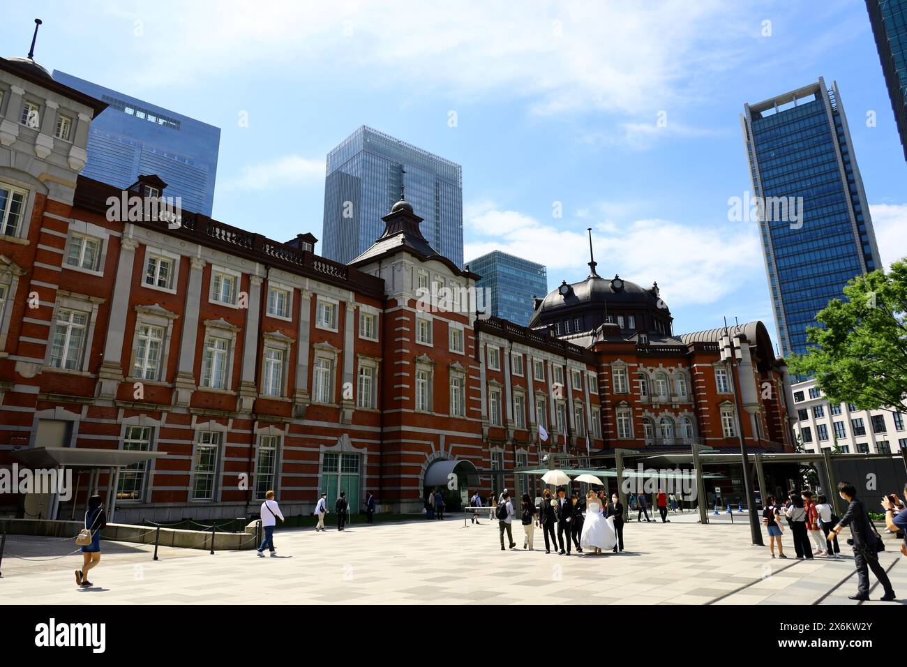 Daily life in Japan　Brick-built Tokyo Station and a couple in wedding dresses taking wedding photos Stock Photo