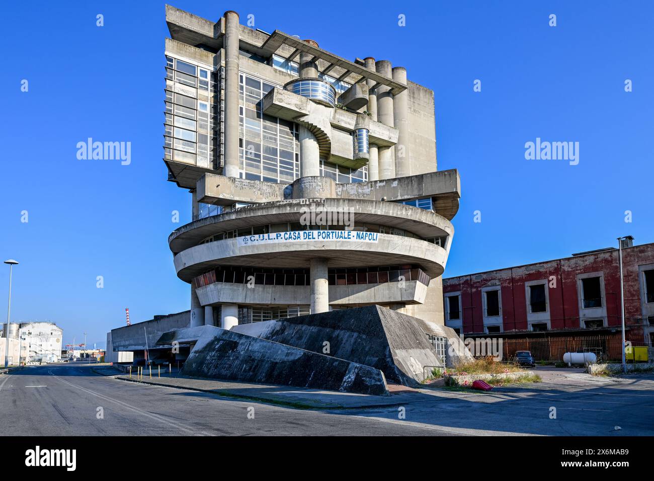 Naples, Italy - Aug 14 2023: Casa del Portuale, a now abandoned building  for workers at the port of Naples, designed by architect Aldo Loris Rossi  and Stock Photo - Alamy, image size:1300x956
