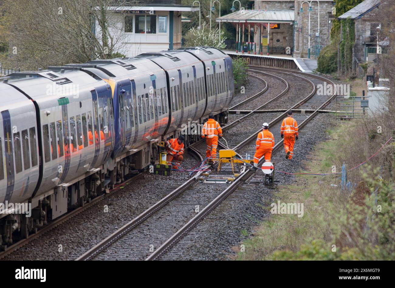 DB Cargo recovery engineers fitting wheel skates to the Northern Class 195 train that derailed at Grange Over Sands, March 2024 Stock Photo