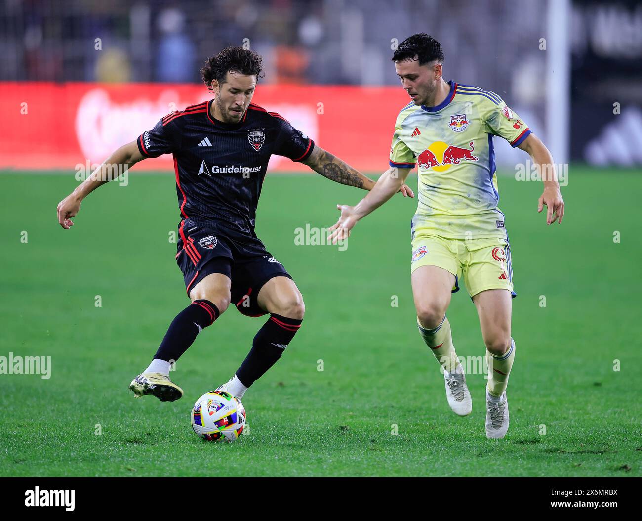 May 15, 2024: D.C. United Defender (22) Aaron Herrera works the ball past New York Red Bulls Midfielder (9) Lewis Morgan during an MLS soccer match between the D.C. United and the New York Red Bulls at Audi Field in Washington DC. Justin Cooper/CSM Stock Photo