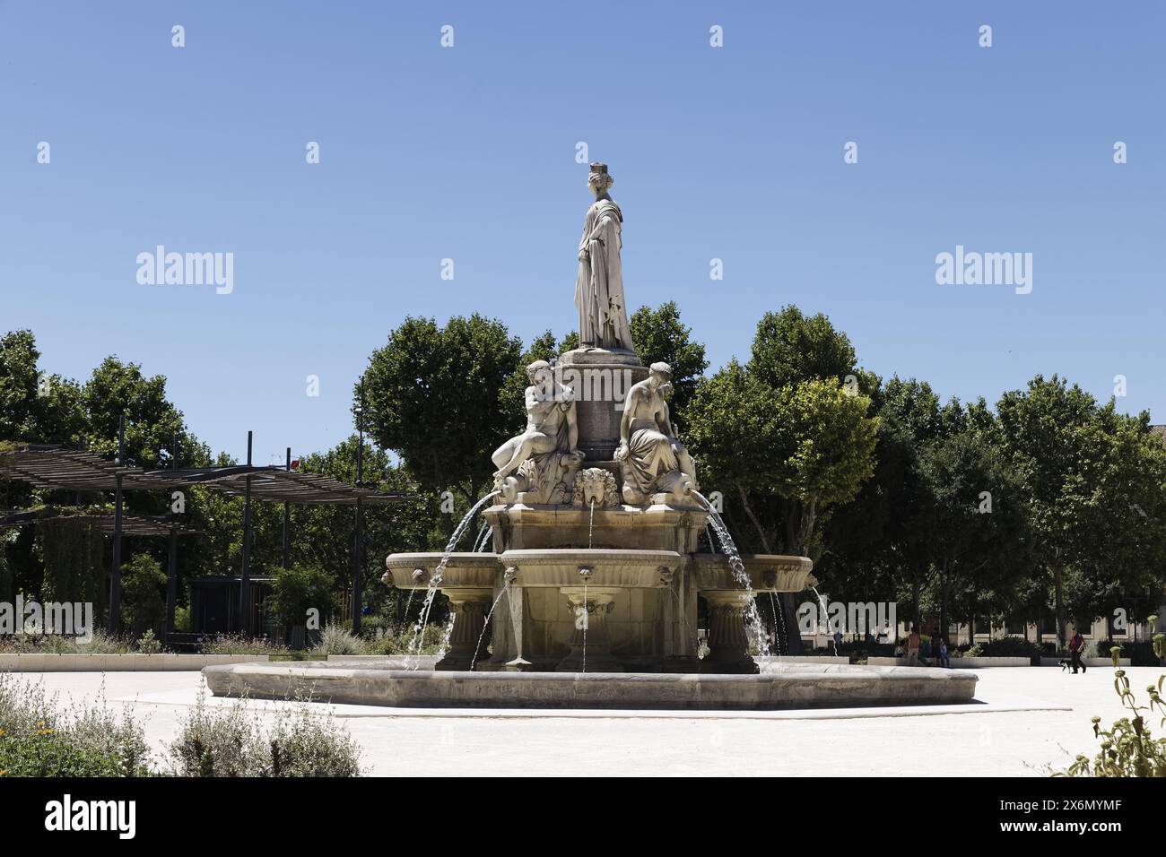 Nîmes, France.11th June, 2022.The Fontaine Pradier with a statue of ancient goddess and four statues of men and women in Nîmes, France Stock Photo