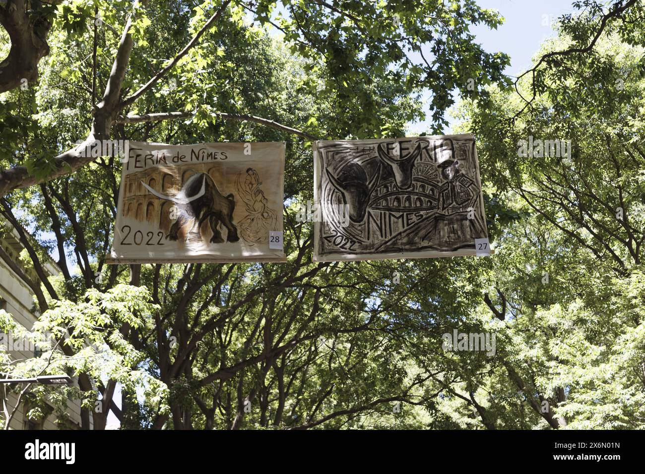 Nîmes, France.11th June, 2022. View of a street with specific Féria banners in the city in Nîmes, France Stock Photo