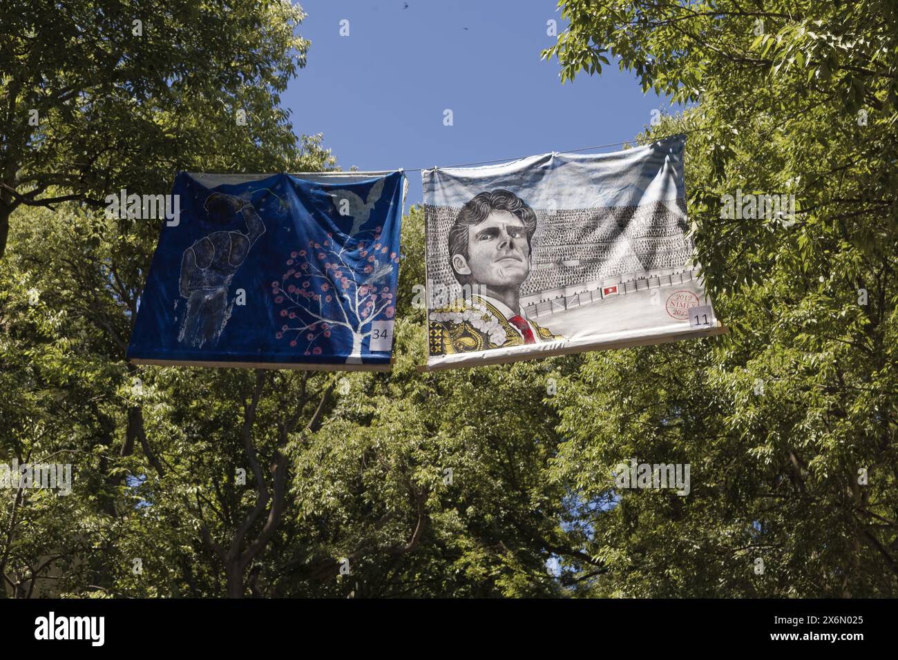 Nîmes, France.11th June, 2022. View of a street with specific Féria banners in the city in Nîmes, France Stock Photo