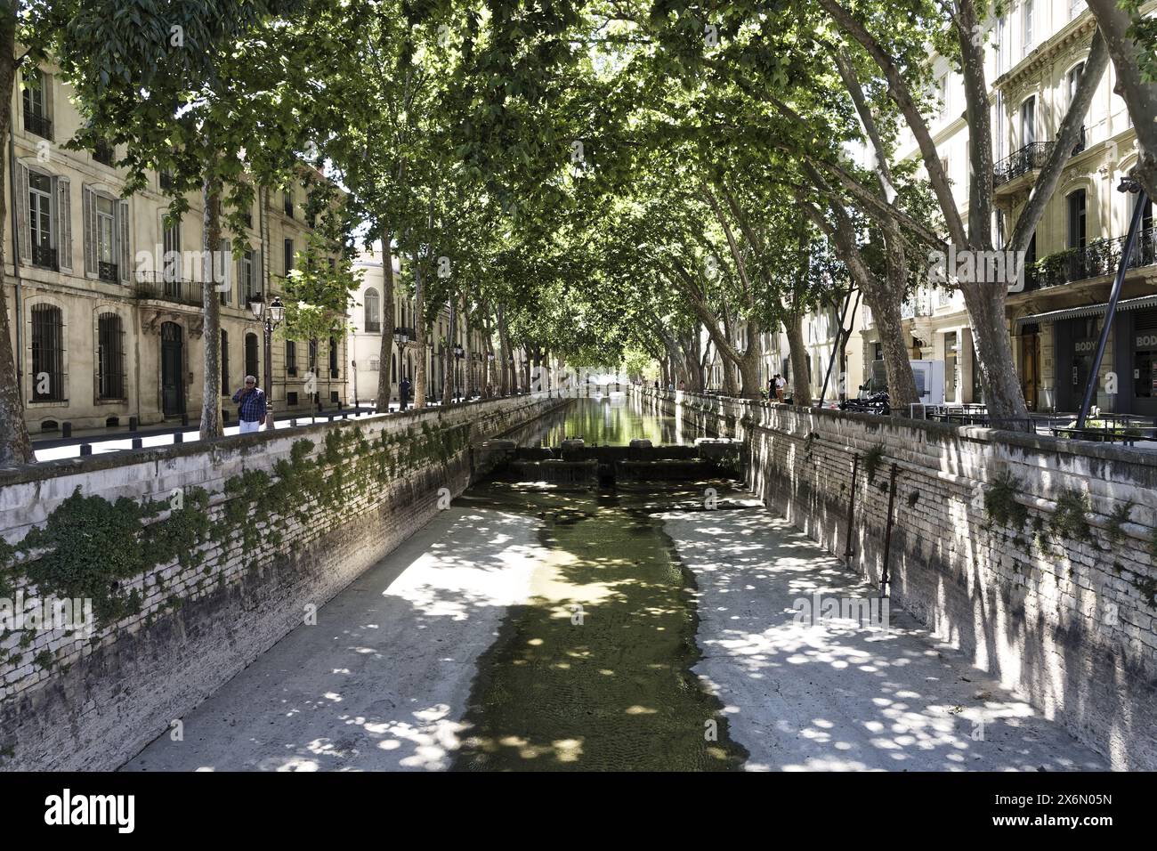 Nîmes, France.11th June, 2022. The Quai de la Fontaine canal brings water from the Jardin de la Fontaine in Nîmes, France Stock Photo