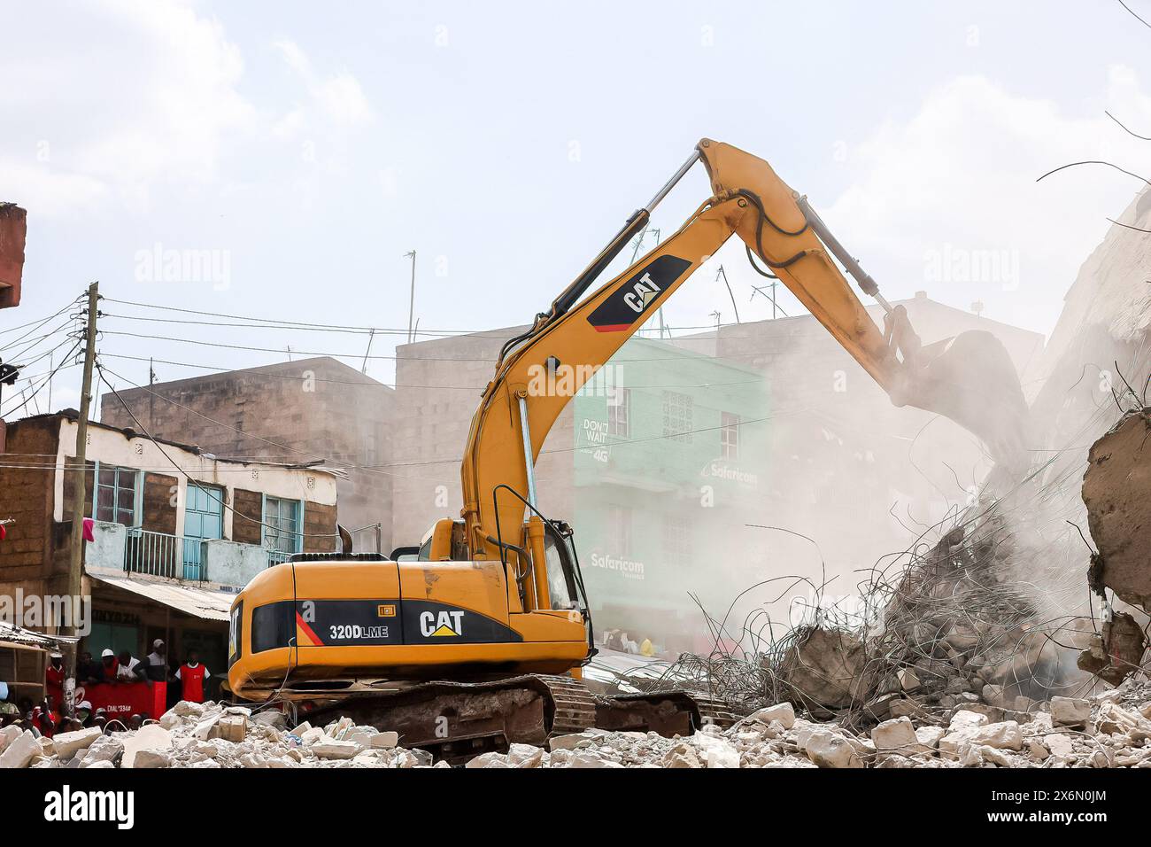 A building is demolished in Mathare as rescue operations continue to ...