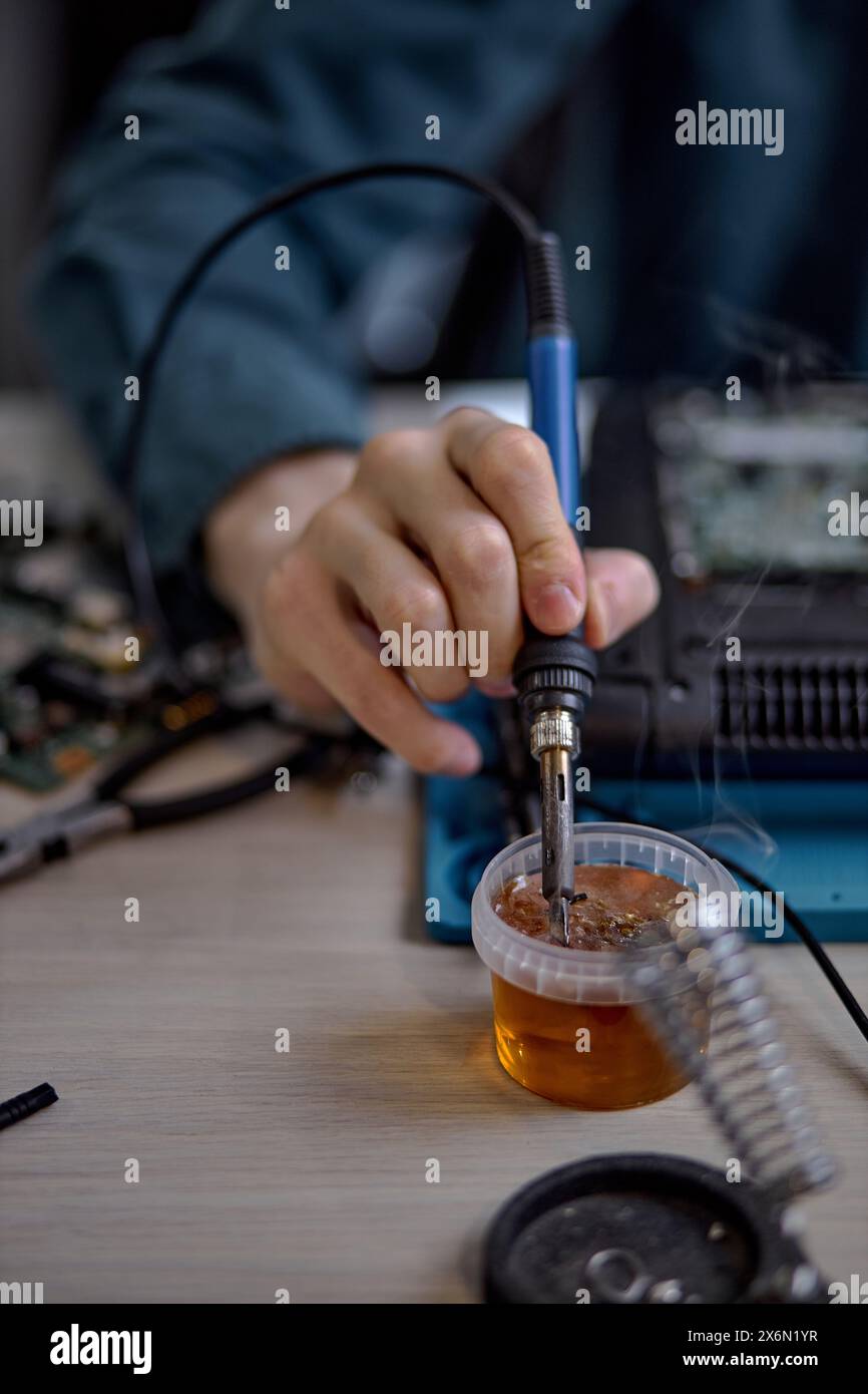 Closeup of unrecognizable engineer technician hands repairing faulty on ...