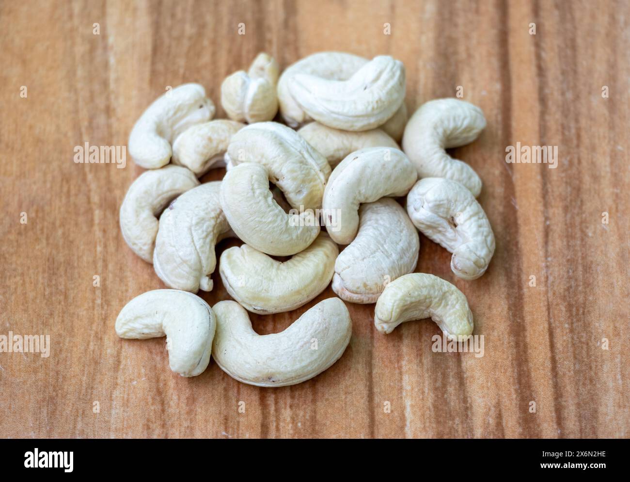 Delicious cashew nuts on wooden background. Cashews are a healthy food