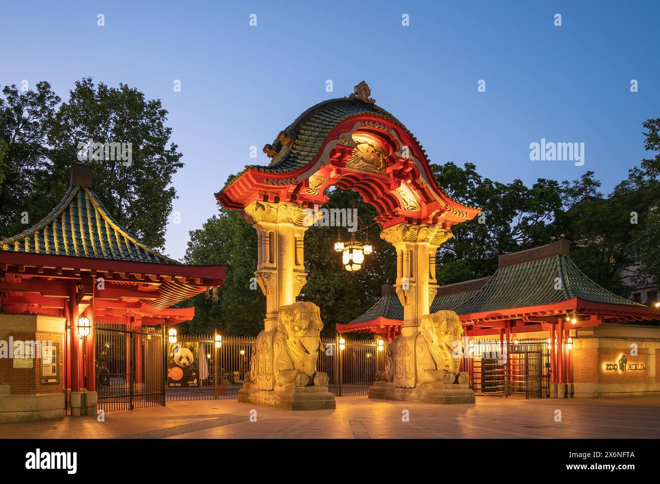 Berlin, Germany - May 14. 2024: The illuminated entrance gate to the Berlin Zoo on a summer evening Stock Photo