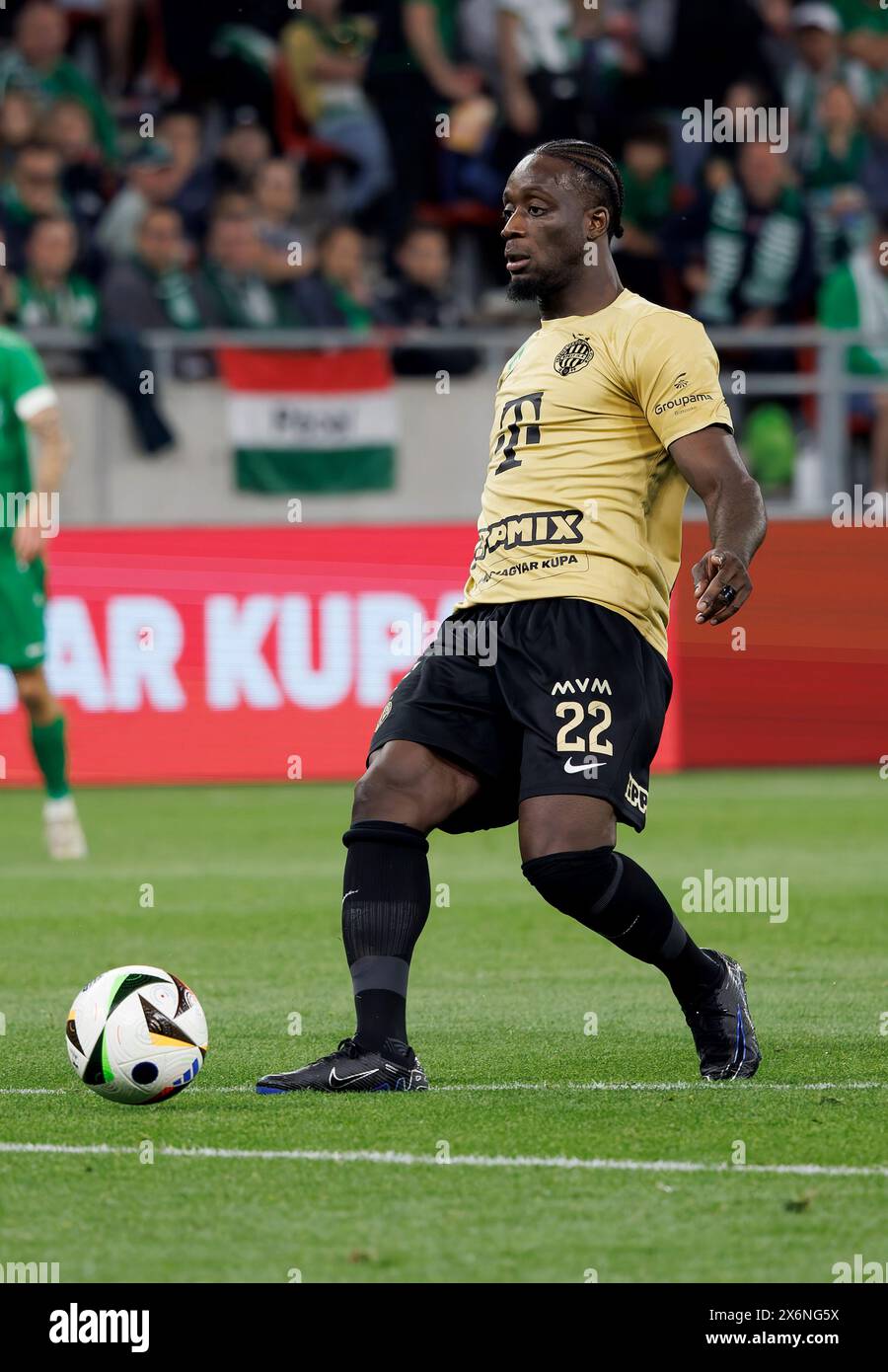 Budapest, Hungary. 15th May, 2024. Myenty Abena of Ferencvarosi TC passes the ball during the Hungarian Cup Final match between Paksi FC and Ferencvarosi TC at Puskas Arena on May 15, 2024 in Budapest, Hungary. Credit: Laszlo Szirtesi/Alamy Live News Stock Photo