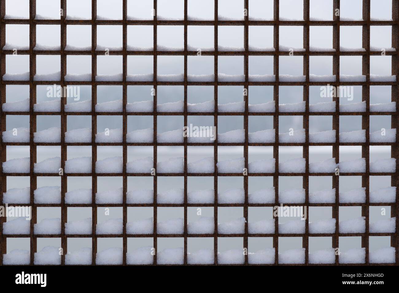 Metal grille with snow Stock Photo