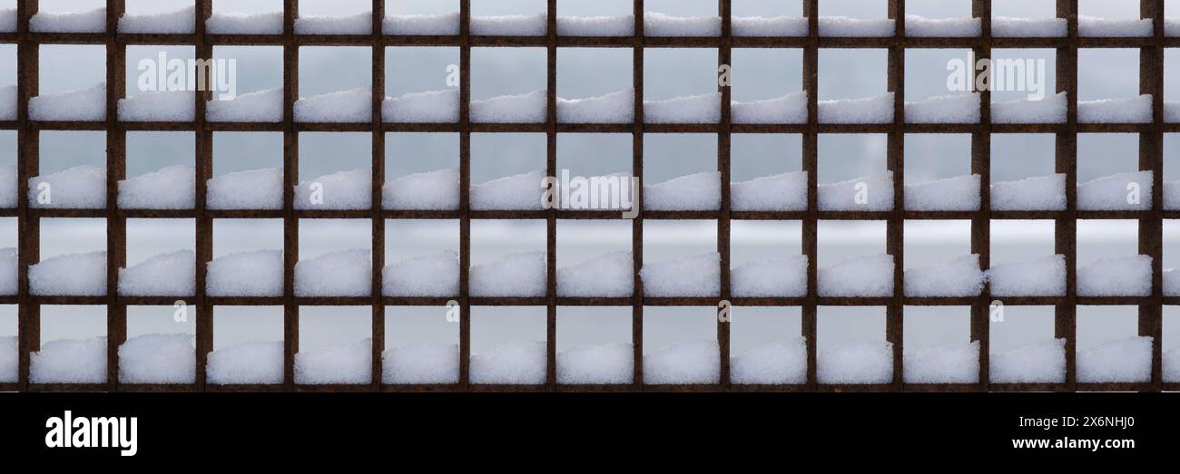 Metal grille with snow Stock Photo