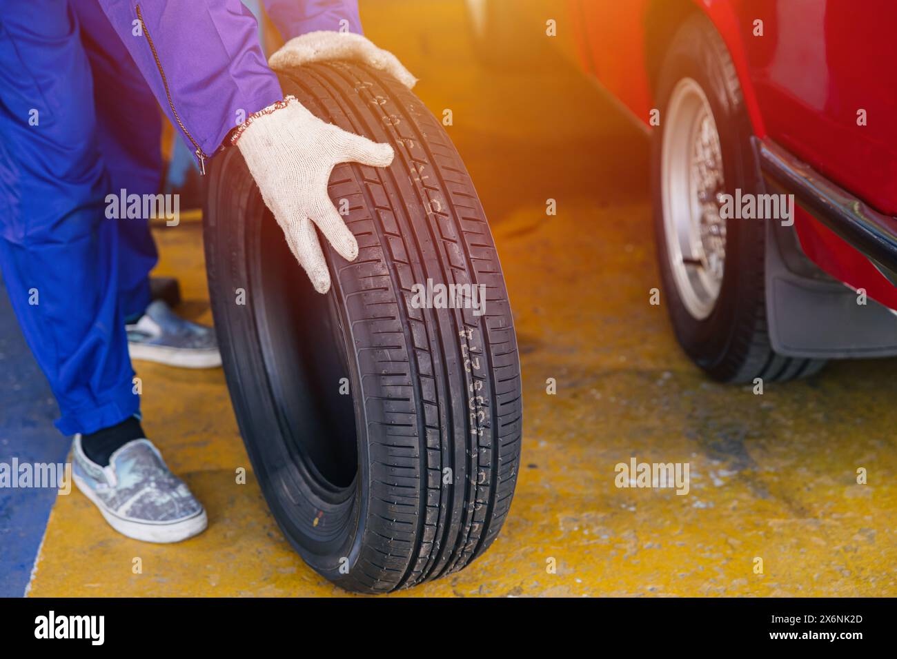 Wheel Tire change, Garage mechanic worker replace car tyre new rubber