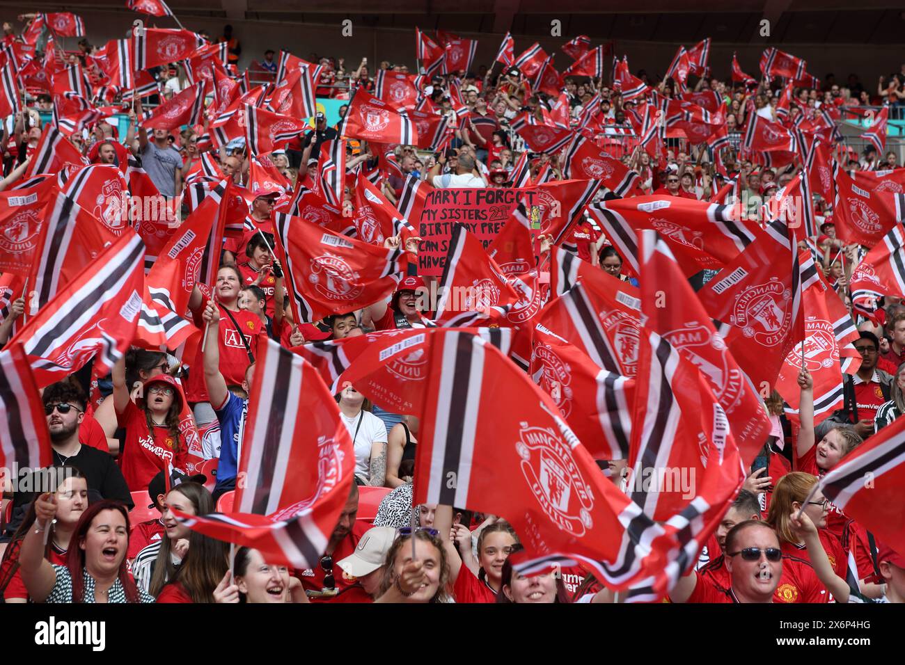 Manchester United women fans with red flags Adobe FA Women's Cup final,  v Tottenham Hotspur Women Wembley Stadium London UK 12 May 2024 Stock Photo