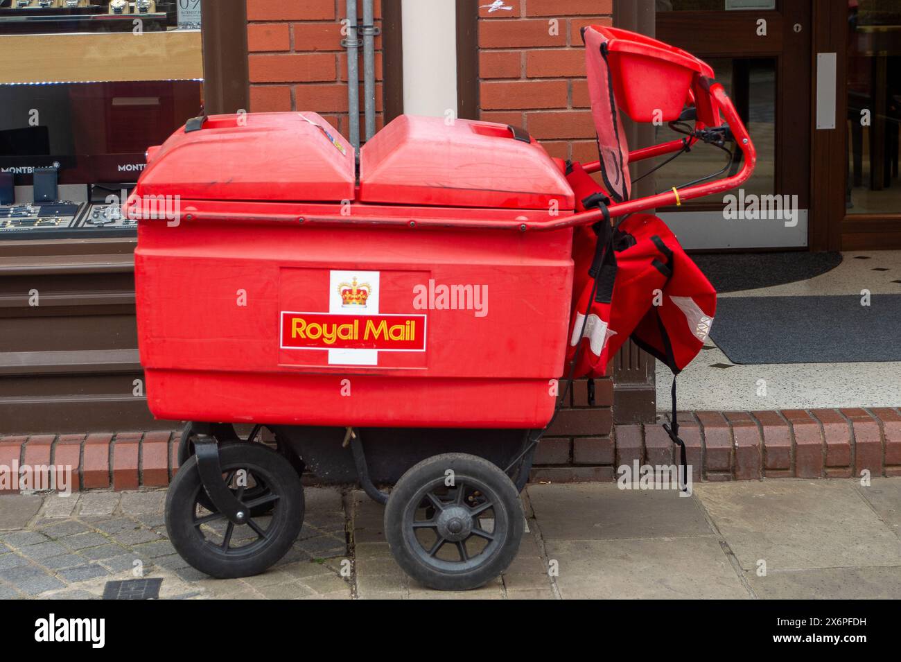 Windsor, Berkshire, UK. 16th May, 2024. A Royal Mail delivery cart in Windsor, Berkshire. The owner of Royal Mail are reportedly expected to accept a £3.5bn takeover bid from a Czech billionaire, Daniel Kretinsky. Royal Mail owners, International Distribution Services said it had received a revised proposal of 370p a share from Mr Kretinsky's EP Group. Credit: Maureen McLean/Alamy Live News Stock Photo